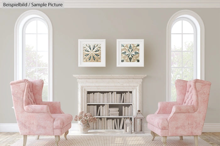 Elegantly decorated room with two pink armchairs, a white fireplace, and framed artwork on a pale gray wall.