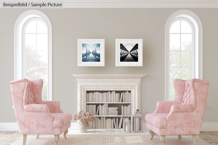 Elegant sitting area with two pink armchairs, a white fireplace, and framed art on a light gray wall.