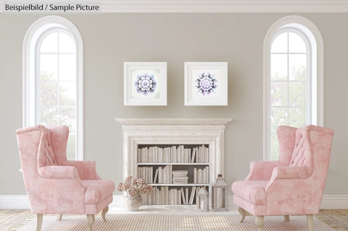 Elegant room with pink armchairs, a decorative fireplace, two mandala artworks, and bookshelves.