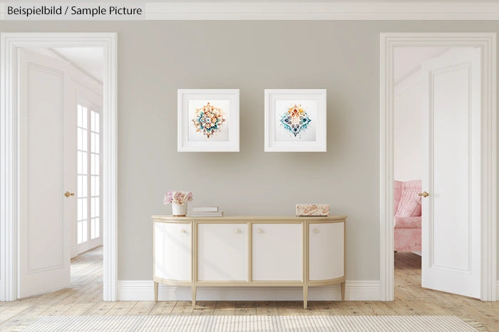 Modern living room with two abstract paintings, a white console, and light wood flooring.