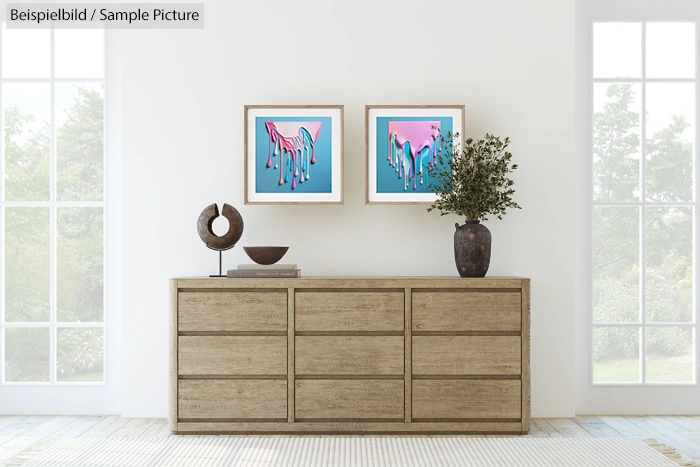 Modern living room with a wooden dresser, abstract wall art, and decorative vases.