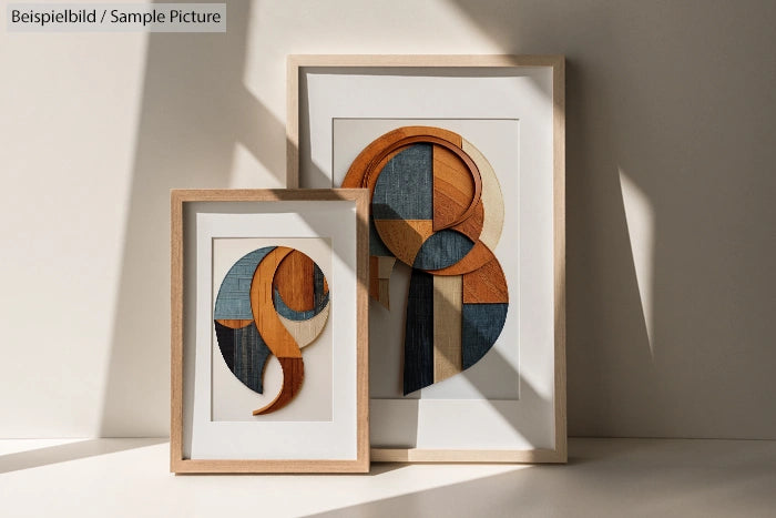 Abstract art with geometric shapes and wood textures in wooden frames, placed against a light background.