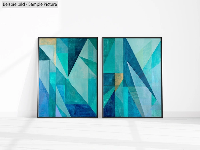 Two abstract paintings with geometric shapes in blue and teal hues, displayed in black frames on a white wall.