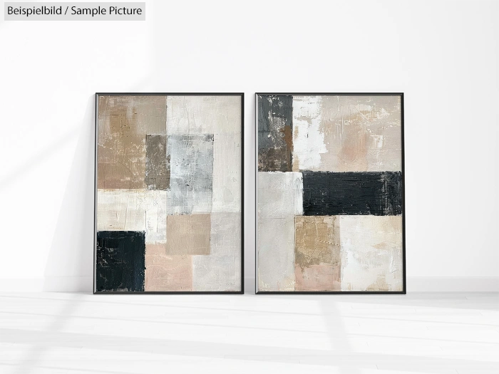 Two abstract paintings with geometric shapes in neutral tones including black, gray, and beige, hung on a white wall.