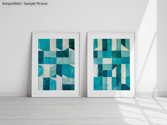 Two framed abstract paintings with teal and white geometric patterns against a white wall.