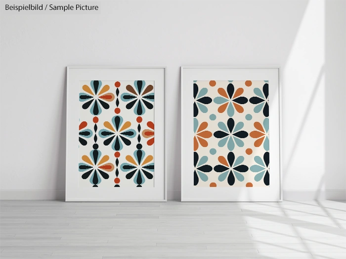 Two framed geometric art prints with colorful floral patterns on a white wall in a bright room.