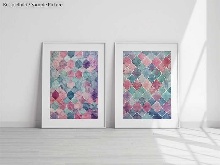 Two framed abstract paintings with colorful geometric patterns in a bright, minimalist room.