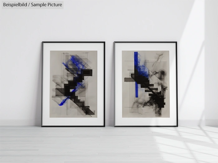 Two framed abstract artworks with black, blue geometric shapes on a light background.