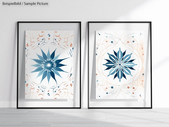 Two framed abstract artworks with floral geometric patterns in blue and beige, displayed against a light wall.