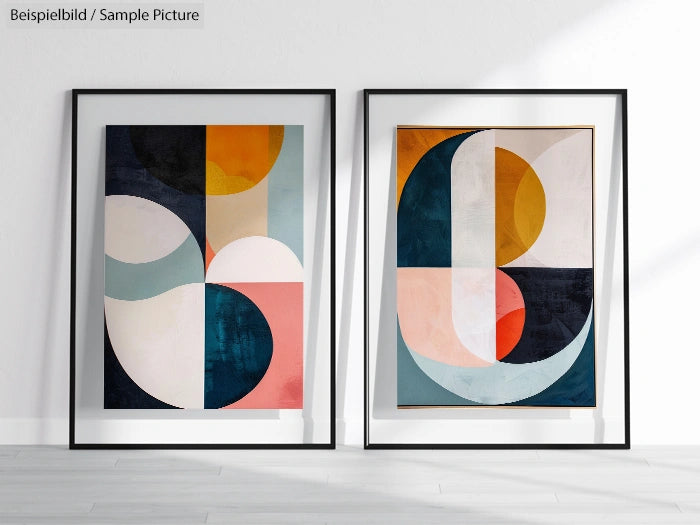 Framed modern abstract art prints with geometric shapes and earth tones on a white wall.