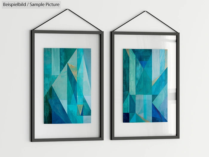 Two abstract geometric art pieces in shades of blue and green framed on a white wall.