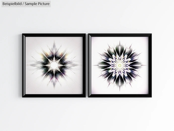 Two framed abstract starburst artworks with black frames on a white wall.