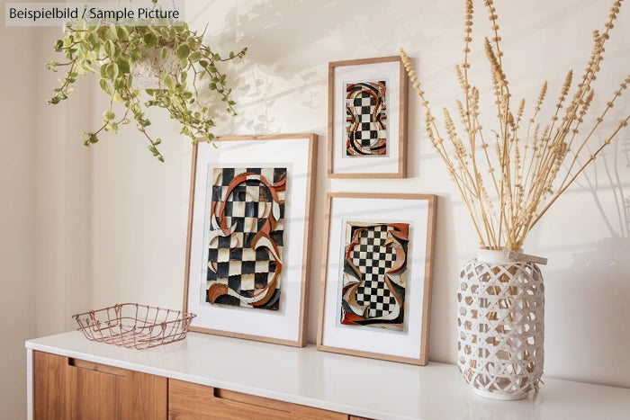 Stylish living room with abstract art, potted plant, and decorative vase; sunlit modern aesthetic.