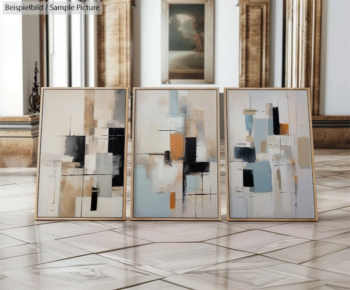 Three abstract paintings with geometric patterns in neutral tones, displayed in an elegant room with polished floors.