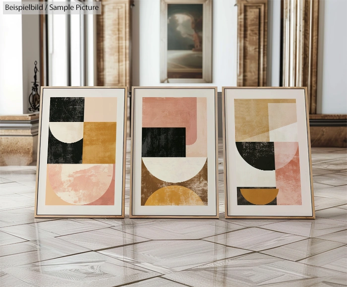 Three abstract paintings with geometric shapes in muted colors displayed in an ornate room with reflective floors.