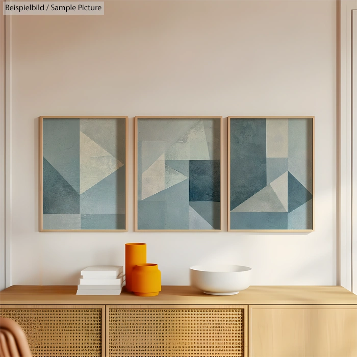 Minimalist dining room with abstract geometric art, wooden sideboard, and orange ceramic accents.