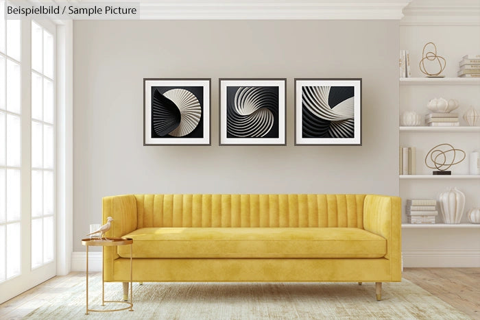 Modern living room with yellow sofa and three abstract framed artworks on a gray wall.