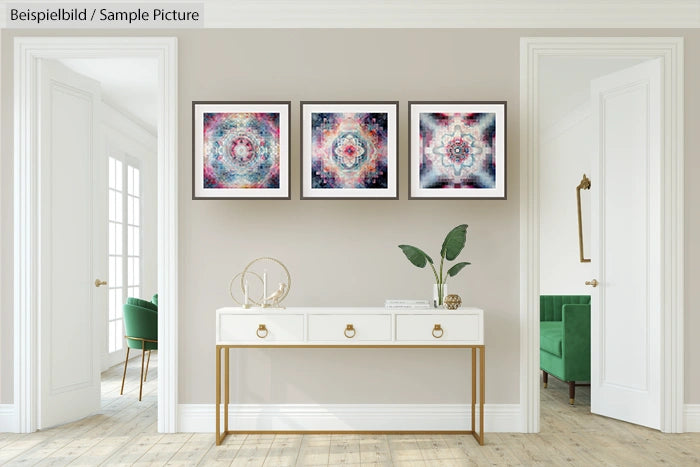 Elegant hallway with three colorful abstract paintings on wall, white console table, and green chairs in adjacent rooms.