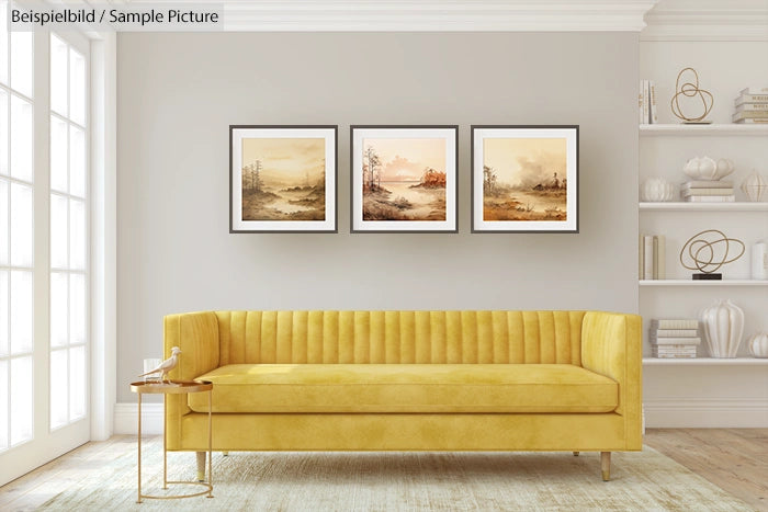 Modern living room with a yellow velvet sofa, three landscape paintings, and white shelves with decorative items.