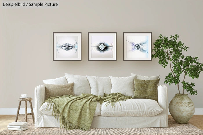 Modern living room with a white sofa, green cushions, and three framed artworks. A potted plant is beside the sofa.