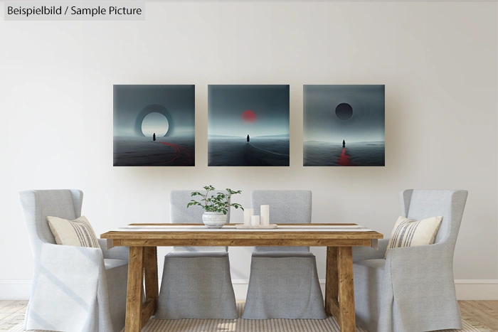 Dining room with wooden table, four gray chairs, and three surreal artworks on the wall depicting solitary figures.