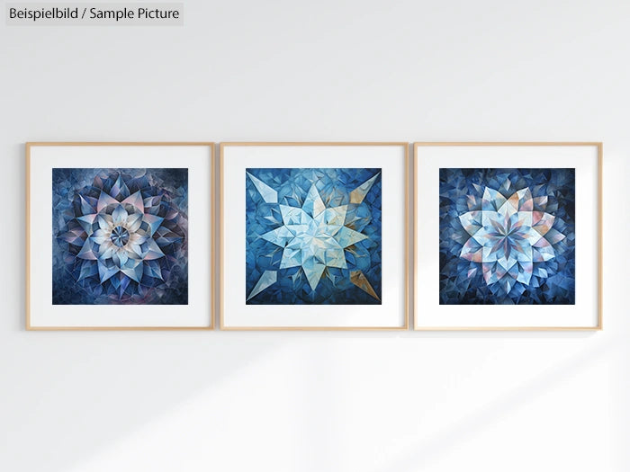 Three framed geometric art pieces with star-like patterns in shades of blue and white, displayed on a light wall.