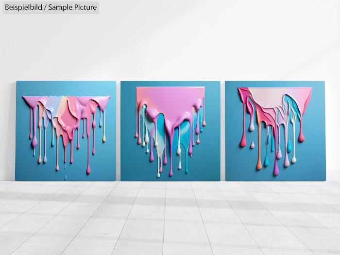 Three abstract artworks featuring colorful drips on a blue background, displayed in a bright, minimalistic gallery space.