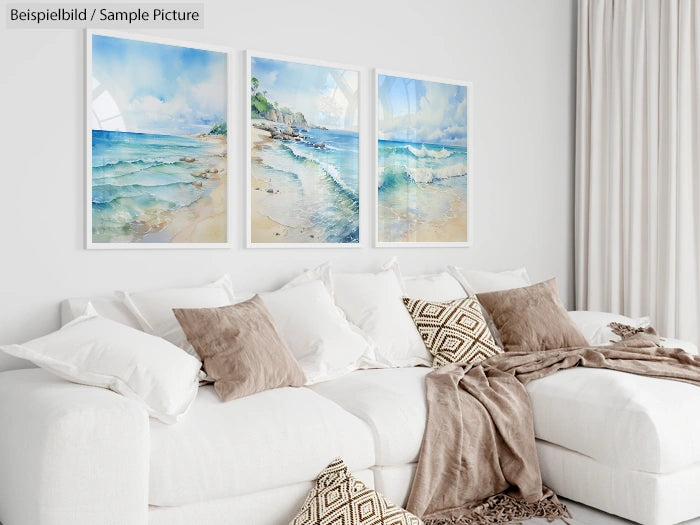 Modern living room with white sofa, beige pillows, and three coastal-themed paintings on the wall.