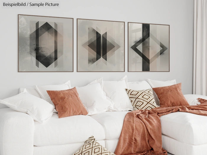 Modern living room with white sofa, terracotta pillows, and abstract geometric art on the wall.