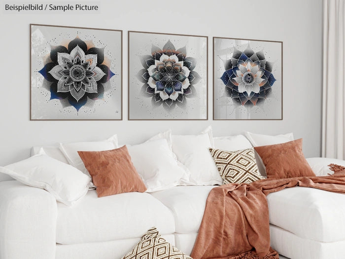 Modern living room with white sofa, caramel cushions, and three geometric floral art pieces on the wall.