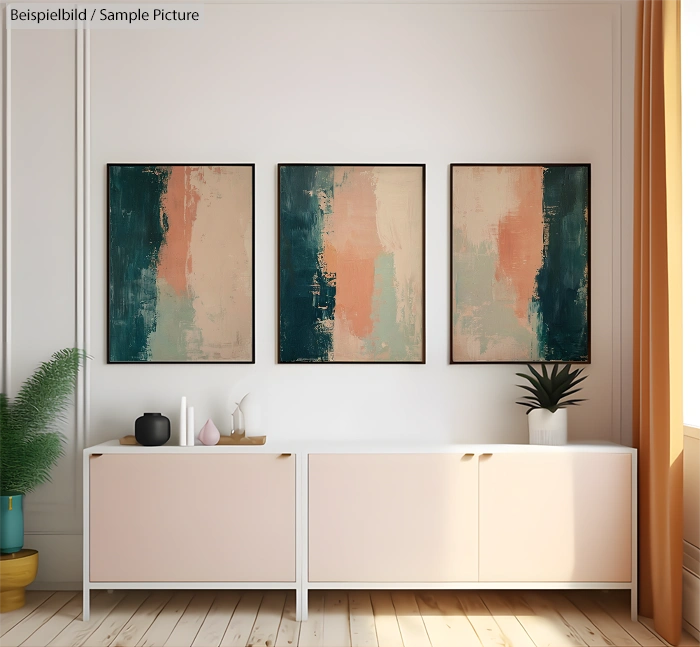 Room with three abstract paintings above a modern sideboard, featuring pastel geometric designs and houseplants.