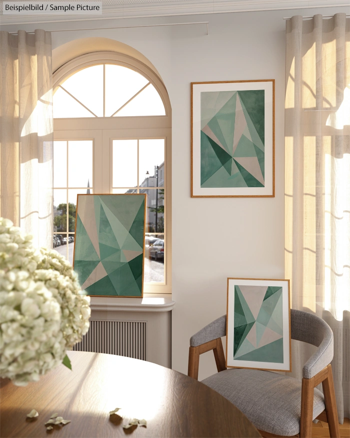 Room with three geometric abstract paintings in green hues, wooden chair, round table, and large window with curtains.