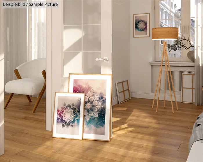 Bright room with wooden floor, framed abstract art, white furniture, and tall lamp near a window.