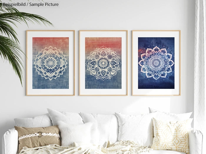 Three framed mandala art pieces on gradient backgrounds above a white sofa with patterned cushions.