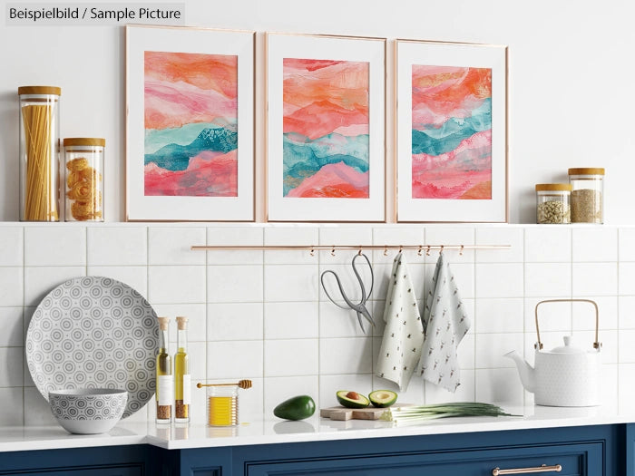 Modern kitchen with colorful abstract art prints, white tiles, and kitchenware on a blue cabinet.