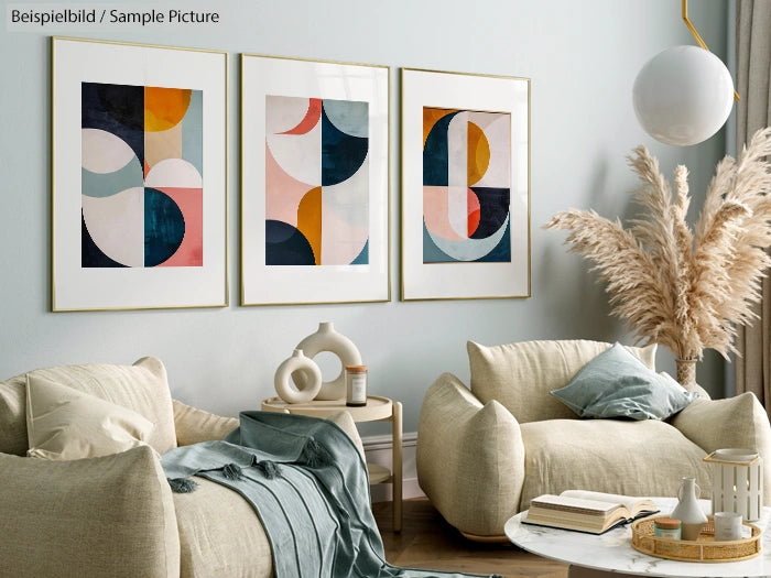 Modern living room with abstract art, cream armchairs, and pampas grass, featuring muted pastels and geometric patterns.