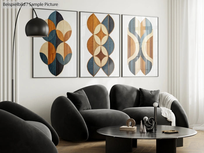 Modern living room with black sofas, round table, abstract art on wall, and a tall floor lamp in natural light.