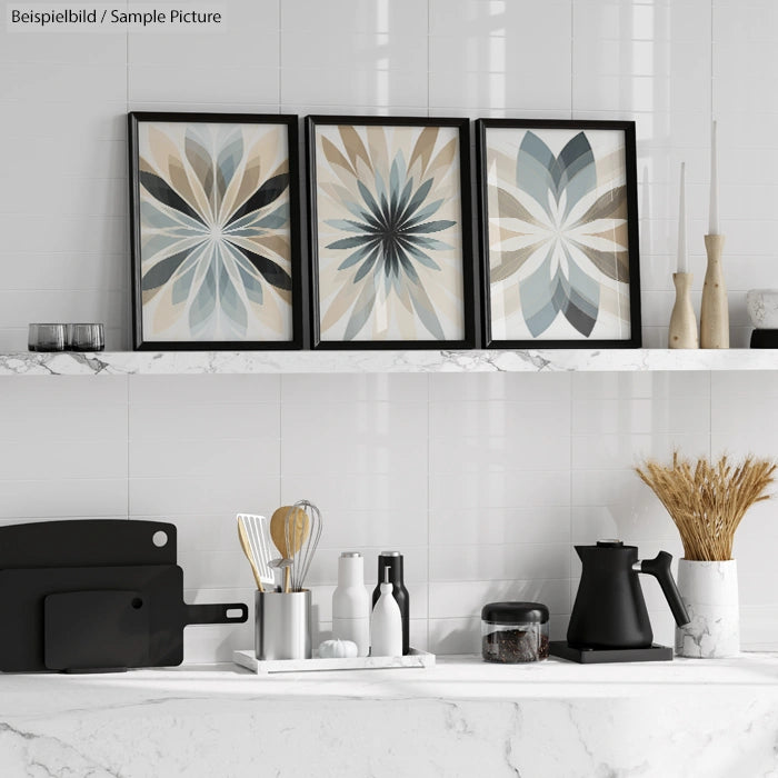 Modern kitchen decor with three abstract floral artworks and marble counter.