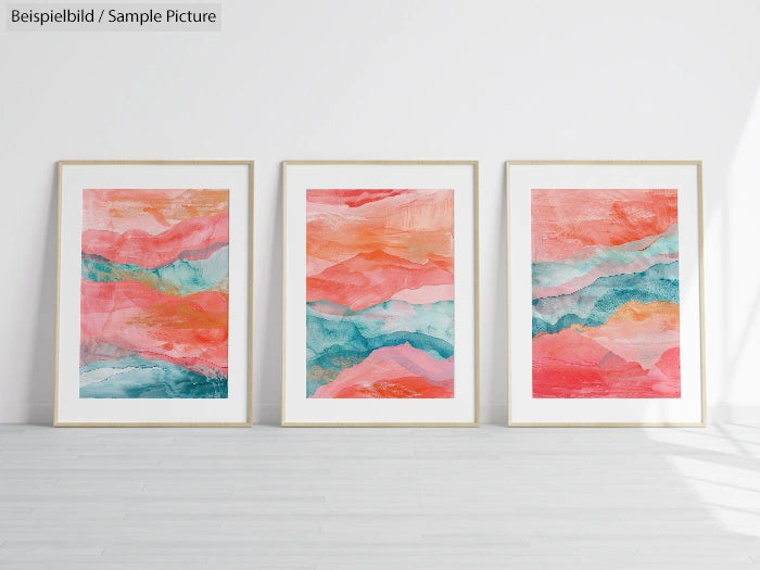 Three framed abstract paintings with pink, orange, and teal wave patterns in a bright gallery setting.