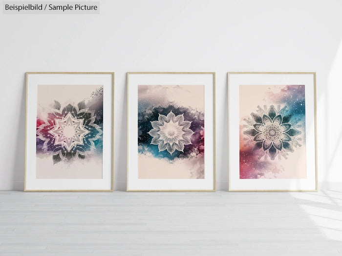 Three framed abstract floral artworks with watercolor backgrounds, displayed on a white wall.