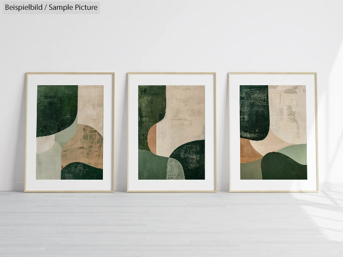 Triptych of abstract green and beige geometric paintings in frames against a white wall.