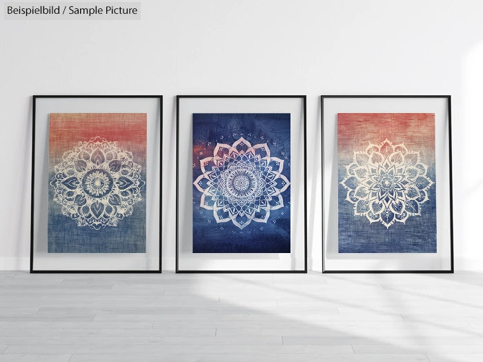 Three framed mandala artworks on a light-colored wall, featuring intricate designs in blue and orange gradients.