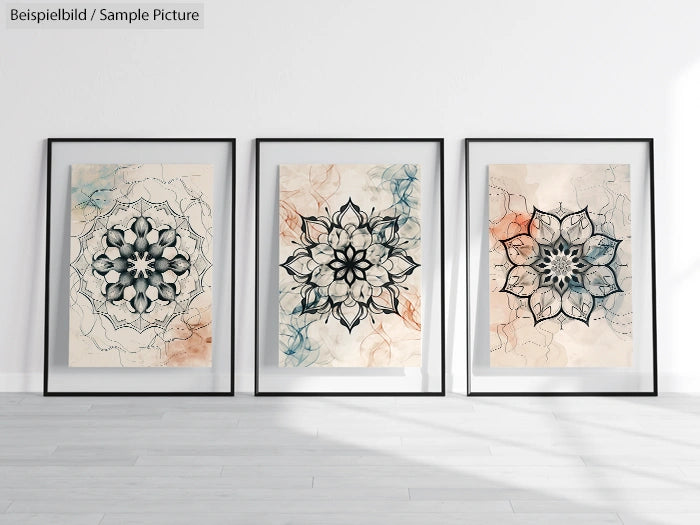 Three framed abstract floral mandala art prints on a white wall, each with intricate black line designs and watercolor backgrounds.