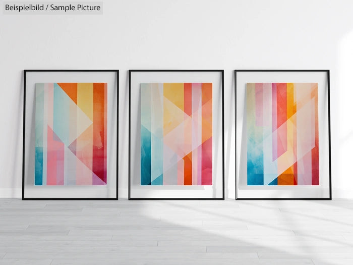 Three framed abstract paintings with colorful geometric shapes in a minimalist gallery setting.