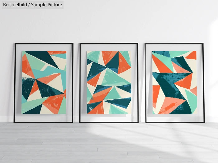 Three framed abstract geometric paintings in teal, orange, and beige hues on a white wall.