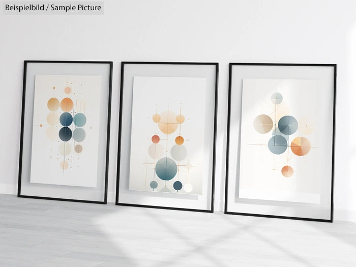 Three framed abstract prints with geometric circle designs in blue and beige tones on a white wall.