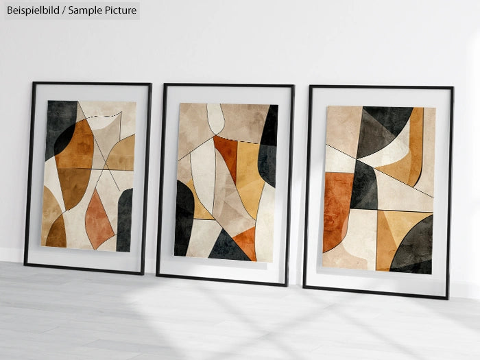 Trio of abstract geometric art prints with beige, brown, and black shapes in minimalist black frames on a white wall.