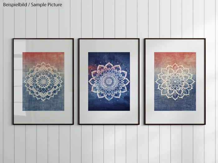 Three framed mandala art prints on a white paneled wall.