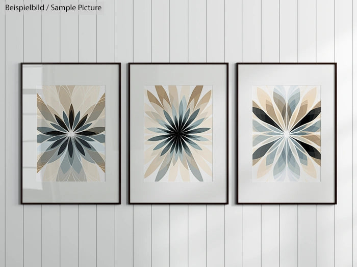 Triptych of framed abstract floral art prints on a white panelled wall.