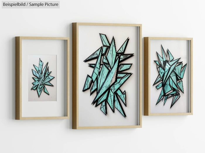 Framed geometric art with teal and black angular shapes on a white background, arranged in three separate frames.